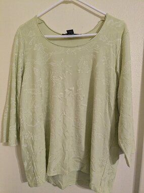 Light lime green shirt.